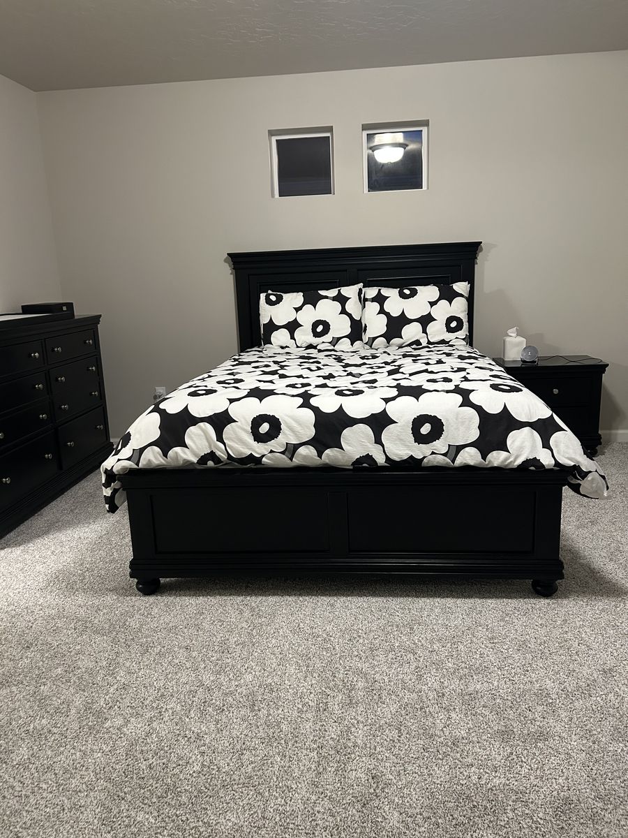 Black queen bed frame with matching dresser and night stand