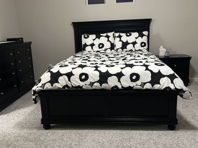 Black queen bed frame with matching dresser and night stand