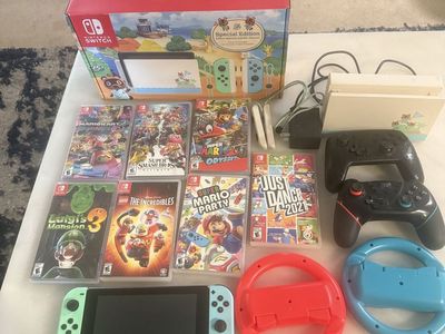 Nintendo Switch Special Edition Console Bundle w/ 8 Games, 2 Pro Controllers, Steering Wheels 16 Gb SD Card