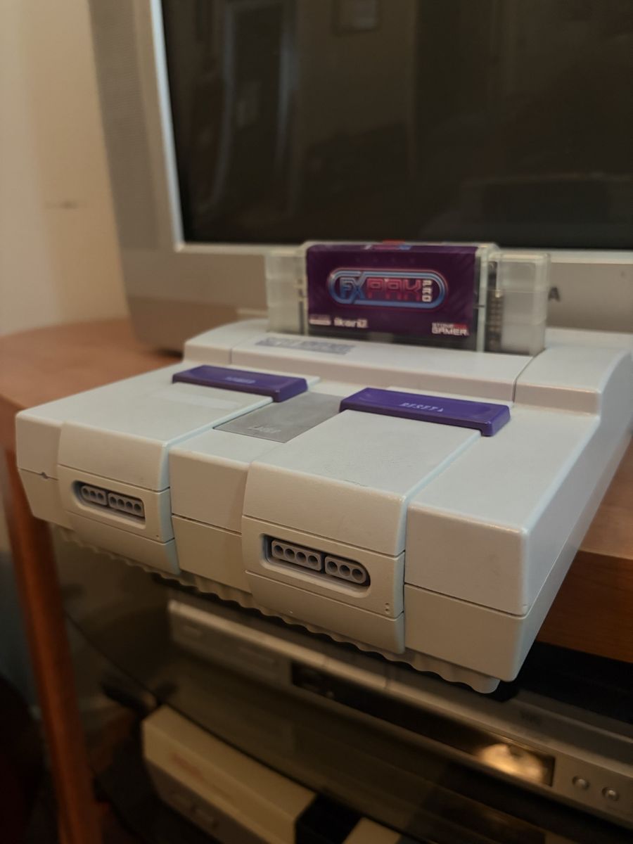 SNES 1 Chip w/Official FXPak Pro (loaded with SmokeMonster ROM Sets) HDRetrovision component cables, OEM power supply.