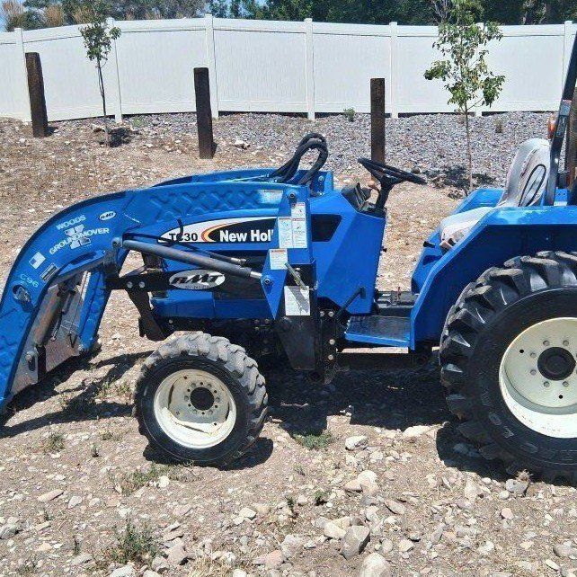 New Holland TC30 tractor loader.