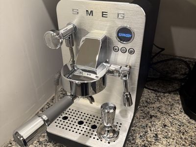Smeg Espresso Machine with Stainless Steel and Black Finish w/ coffee grinder.