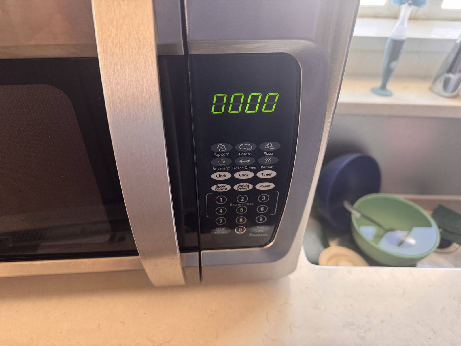 Oster 0.9 cu ft 900W Countertop Microwave Oven - Stainless Steel