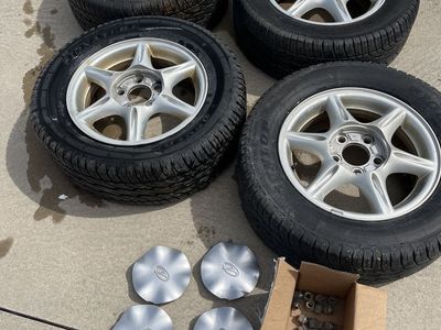 Full Set Of 215/60R-15 Dunlap Tires With Caps And Lug Nuts