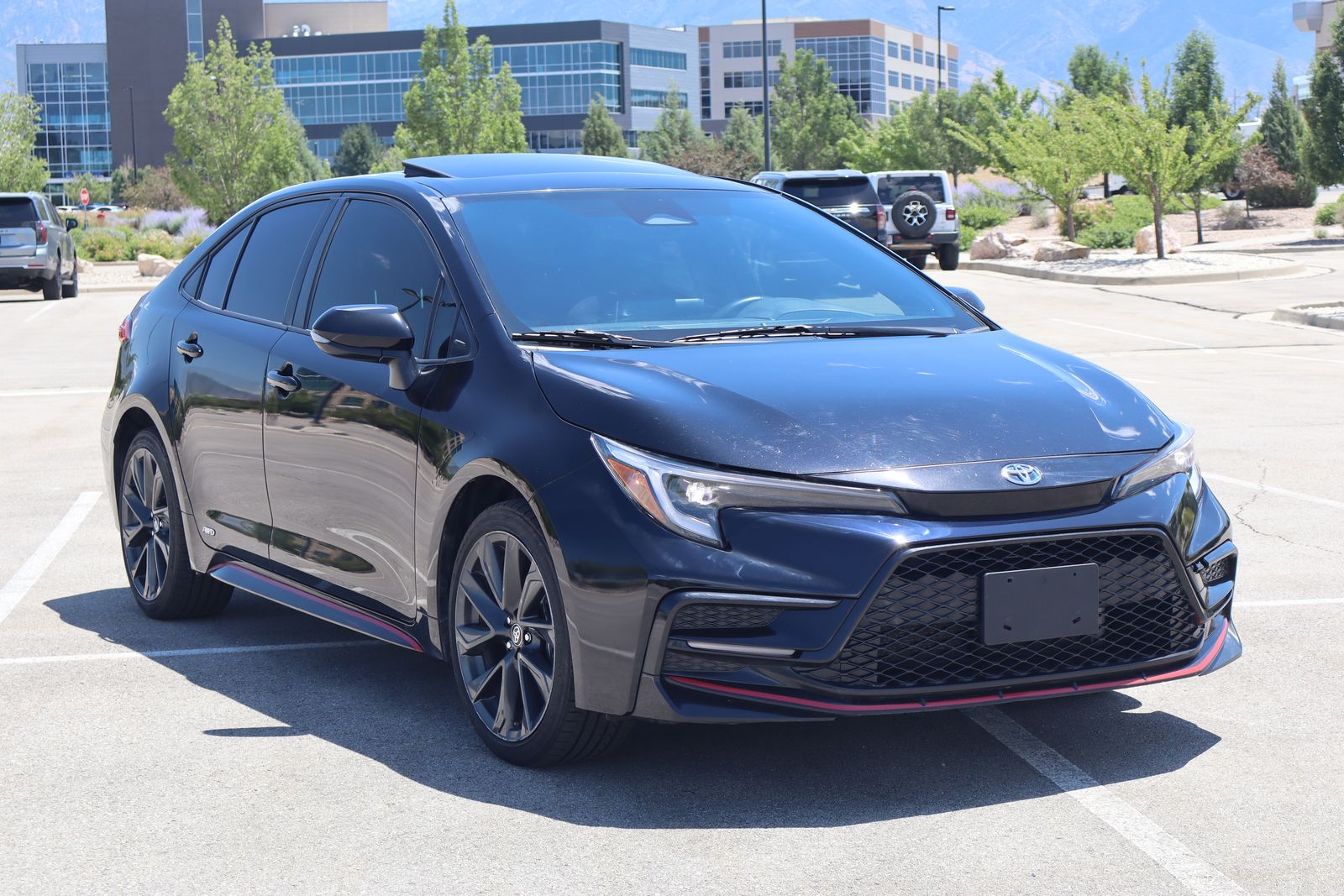2023 Toyota Corolla Hybrid SE Infrared — rebuilt & branded title, 5% below market