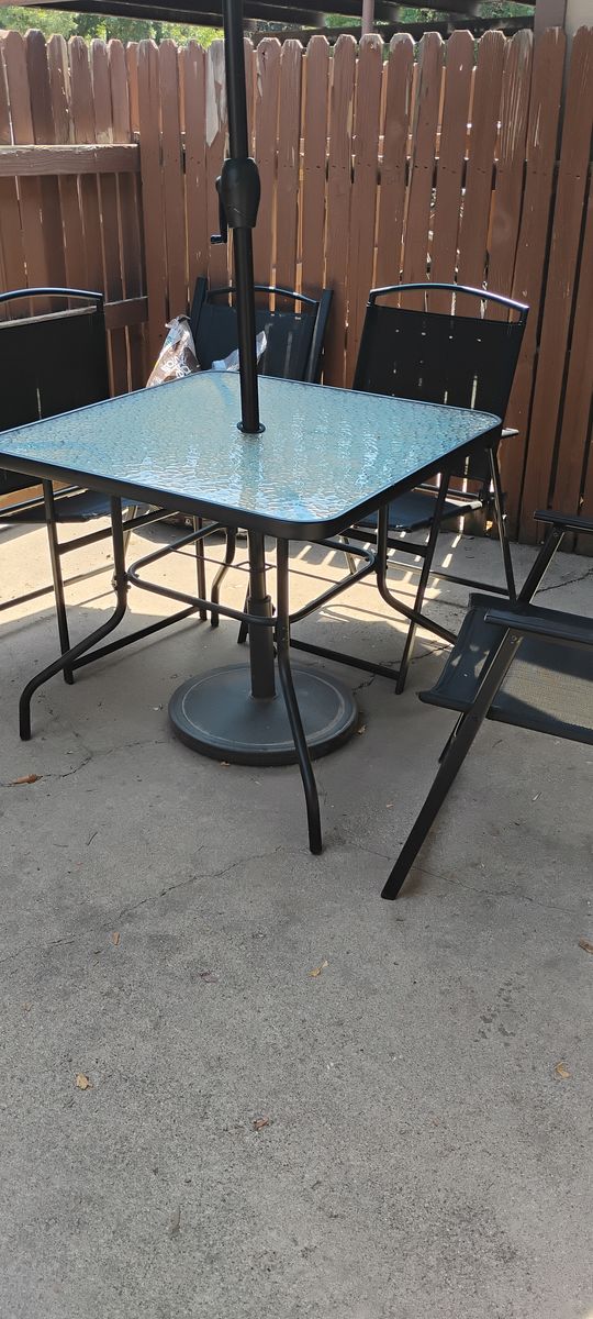 Patio umbrella table with four chairs