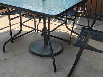 Patio umbrella table with four chairs