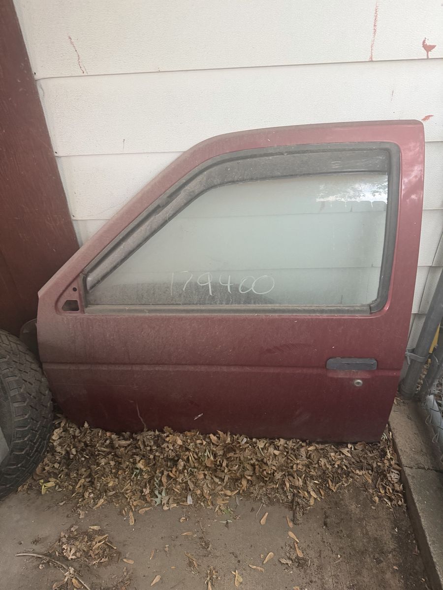 Red Nissan Pickup Door