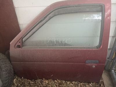 Red Nissan Pickup Door