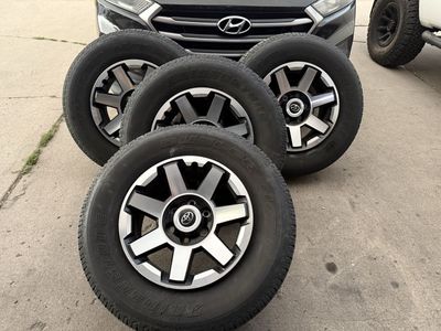 Toyota 4Runner rims with tires; there are no scratches.