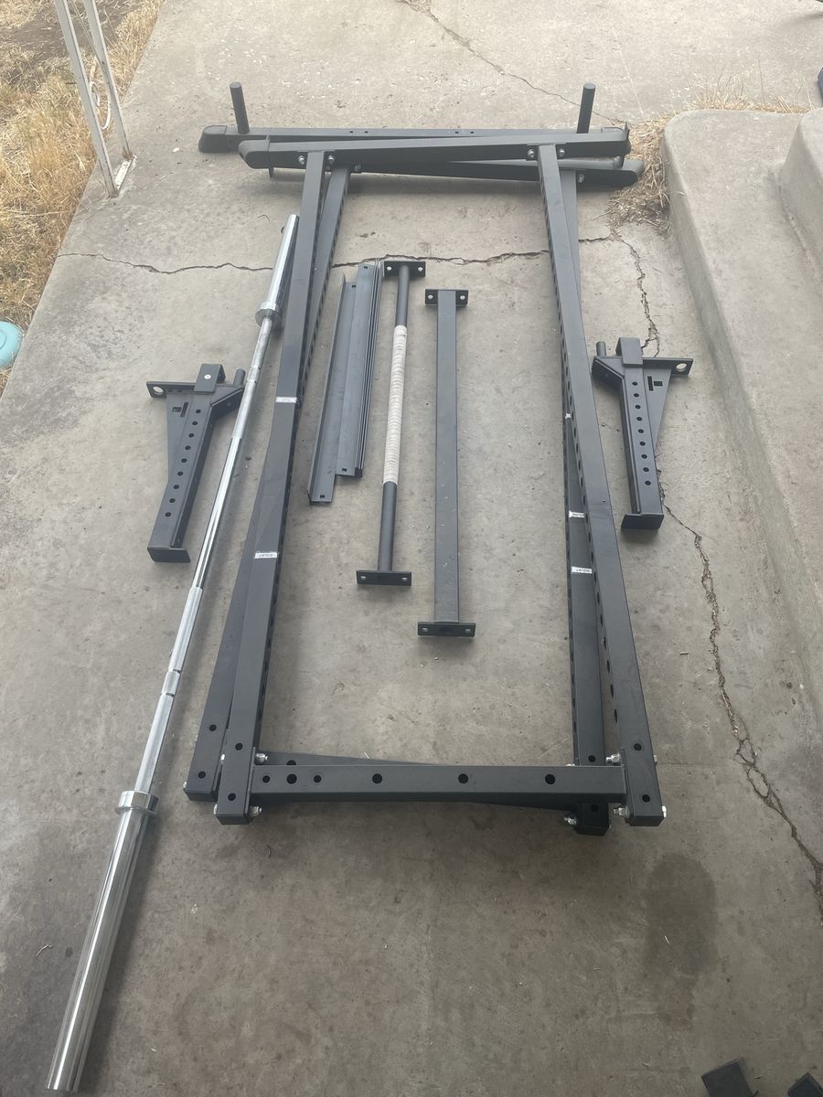 Lifting Rack with high quality Barbell along side Dumbell holders- Black, Used Excellent condition. NO WEIGHTS INCULDED