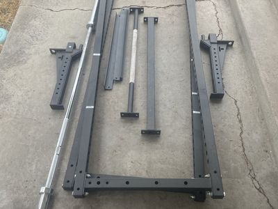 Lifting Rack with high quality Barbell along side Dumbell holders- Black, Used Excellent condition. NO WEIGHTS INCULDED