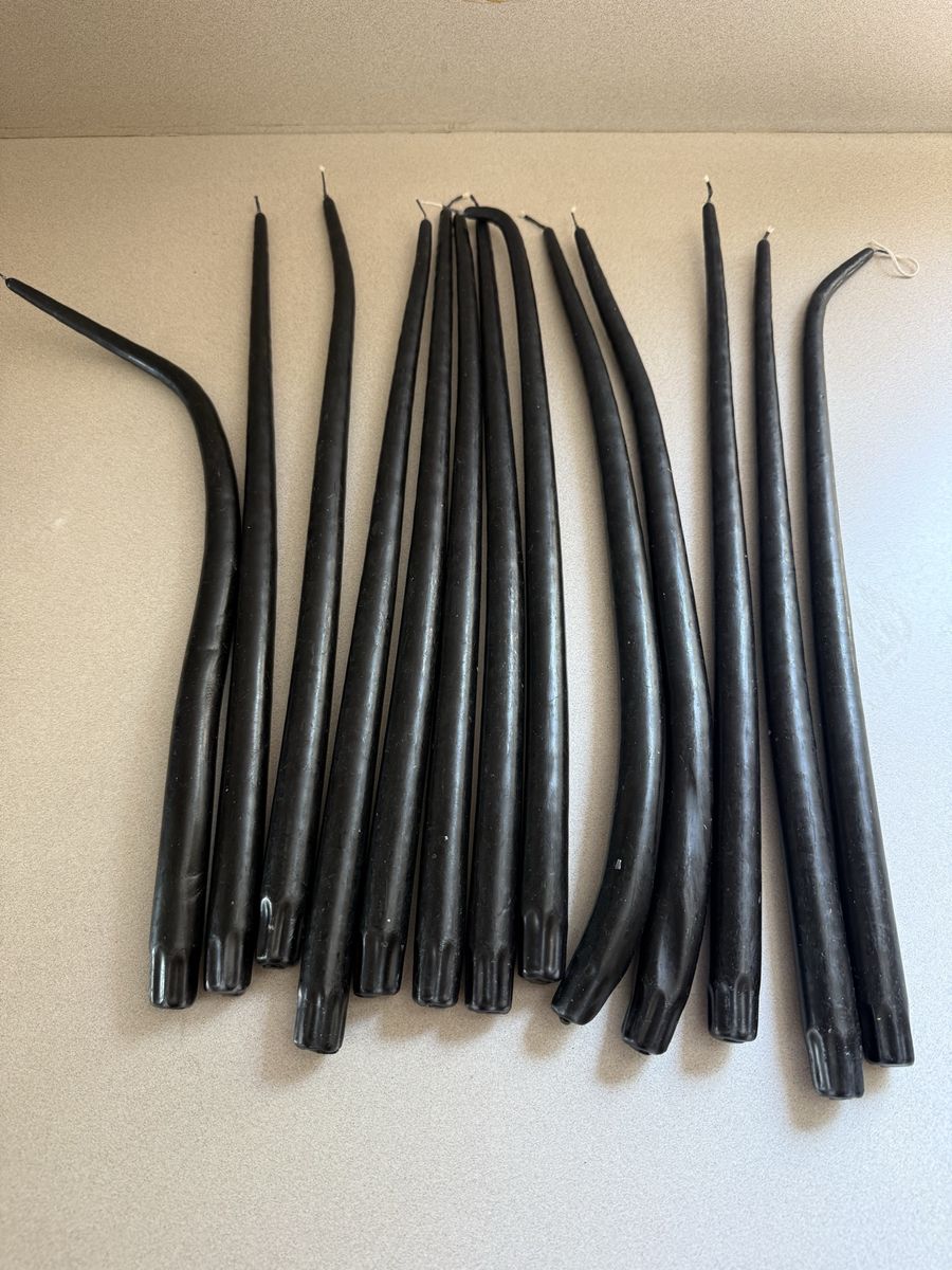 Set of long taper candles 18” T $25 all. Some tweaked in the sun!