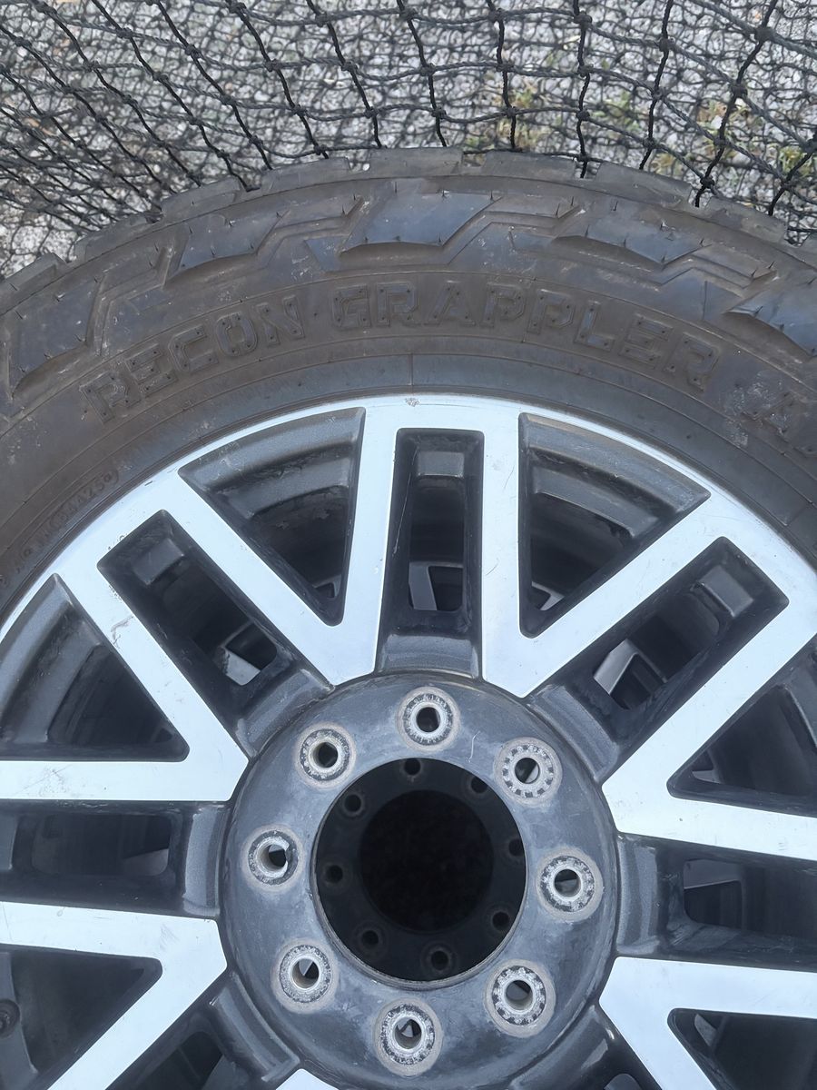 Nitto Recon Grappler A/T Tires on 20" Wheels - 35X12.50R20LT Set of 4