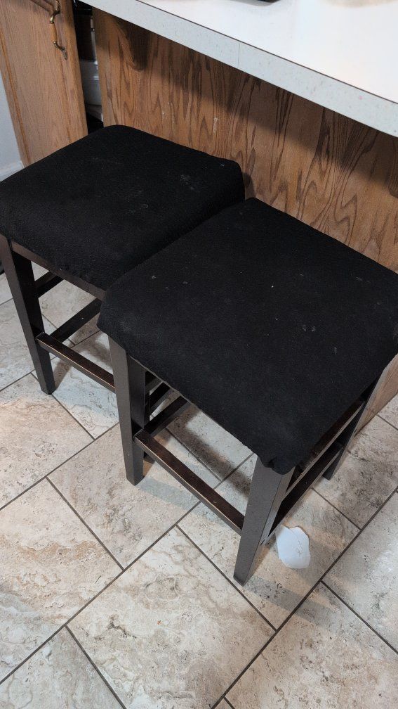 Four Dark Wood Counter Height Bar Stools.