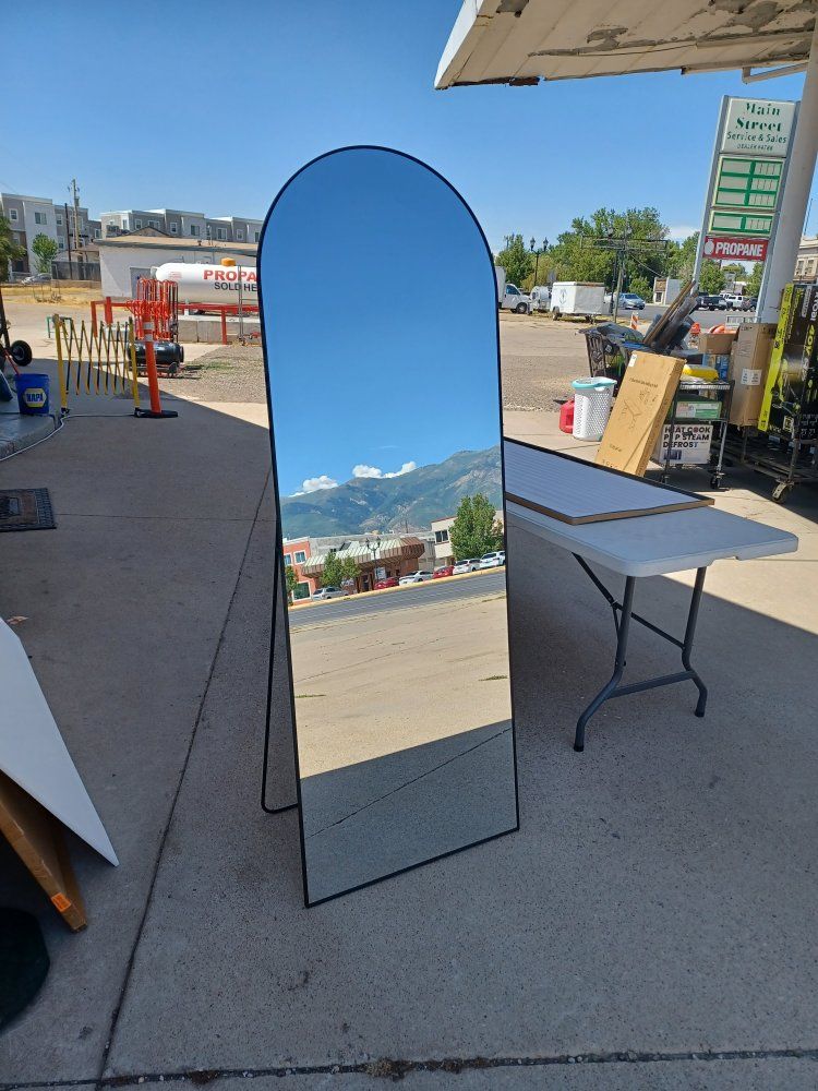 71 in X 26 in arched mirror