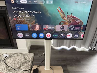 43” TCL TV and stand with wheels