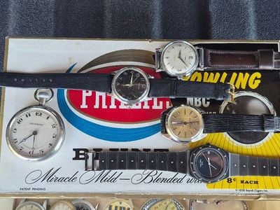 I’m selling a box containing 29 used watches