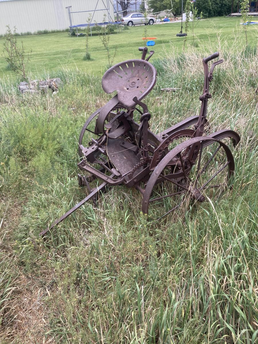 Antique wheels and potato digger.