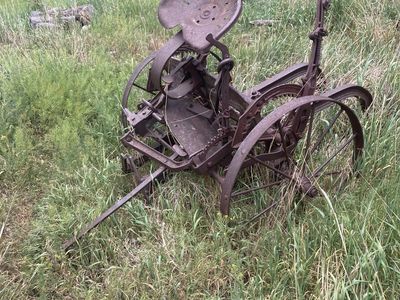 Antique wheels and potato digger.