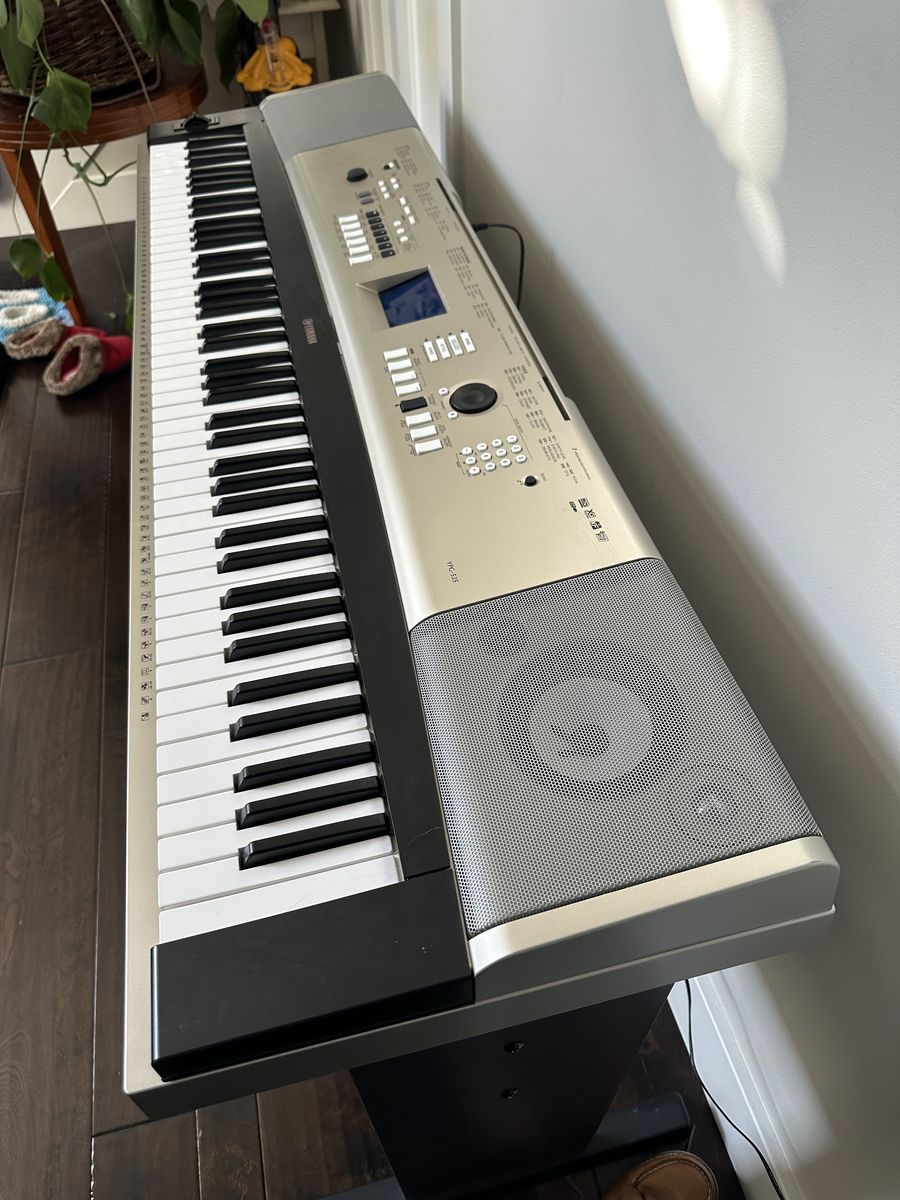 Yamaha YPG-535 88 Key Portable Grand piano/keyboard with music holder, pedal, stand, and bench.