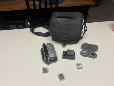 Sony DCR-SR100 Handycam Camcorder 30GB HDD w/ 3.0 Megapixels & Accessories