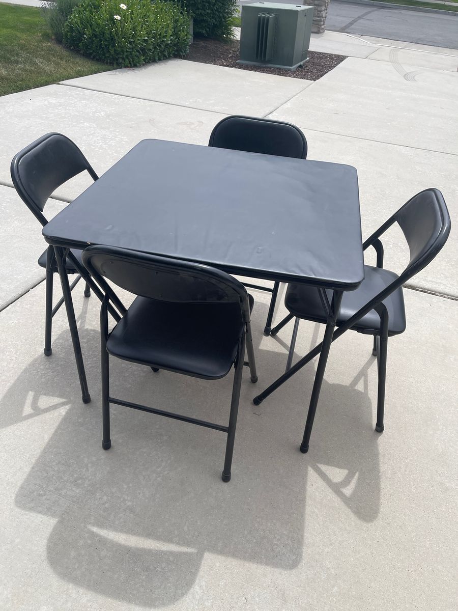 5 piece Black padded card table and chairs.  $49