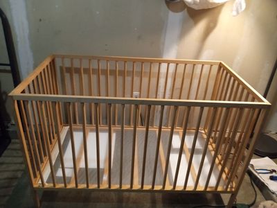 IKEA natural beech wood crib with 51/2" foam mattress, waterproof mattress cover and one organic fitted sheet