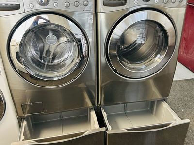 Lg stainless washer and dryer set with pedestals