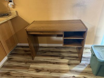 Brown Wooden Student Desk with Built-In Shelving and Storage Cubbies