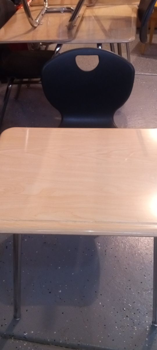 12 Desks with chairs attached and a snowblower for sale great for church, school etc 99 % NEW