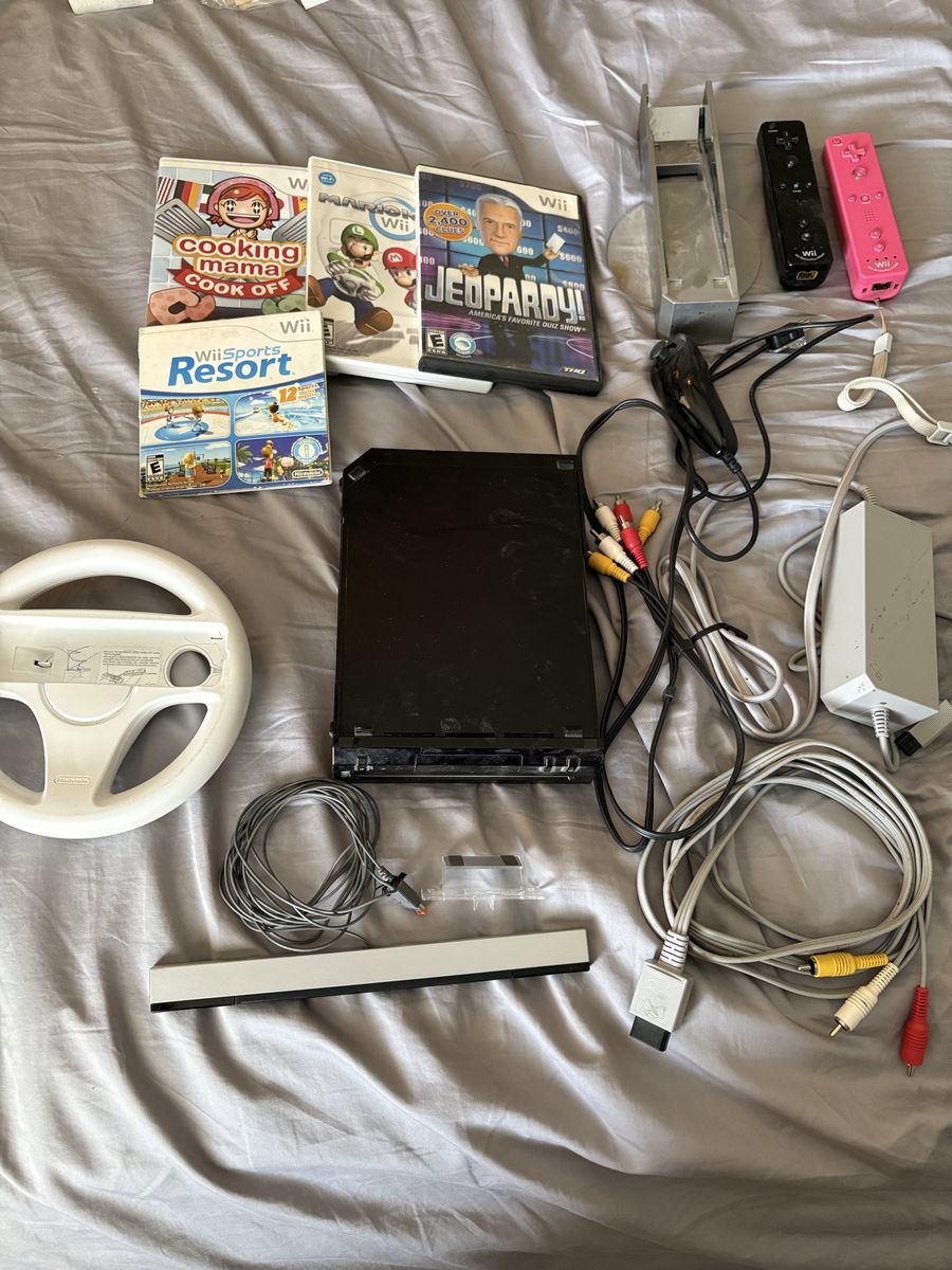 Nintendo Wii Console Bundle with 4 Games, 2 Remotes, Steering Wheel, and Accessories - Used