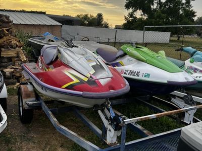 Pair Of Zxi 900 Jet Skis And A Parts Machine