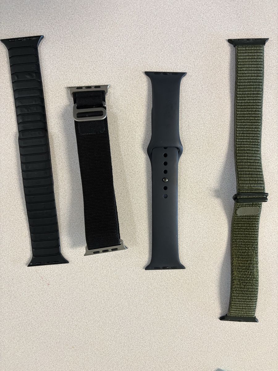 Apple Watch SE (44mm, Black) and Series 7 Cellular (41mm, Blue) with Bands