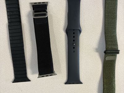 Apple Watch SE (44mm, Black) and Series 7 Cellular (41mm, Blue) with Bands