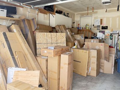 Yard sale full of Unopened Boxed Items: , Planter Boxes, loveseat Sofa &outdoor storage, new furniture.