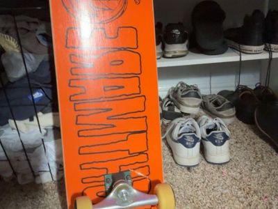 Orange Skateboard with Graphic Bottom and Grip Tape