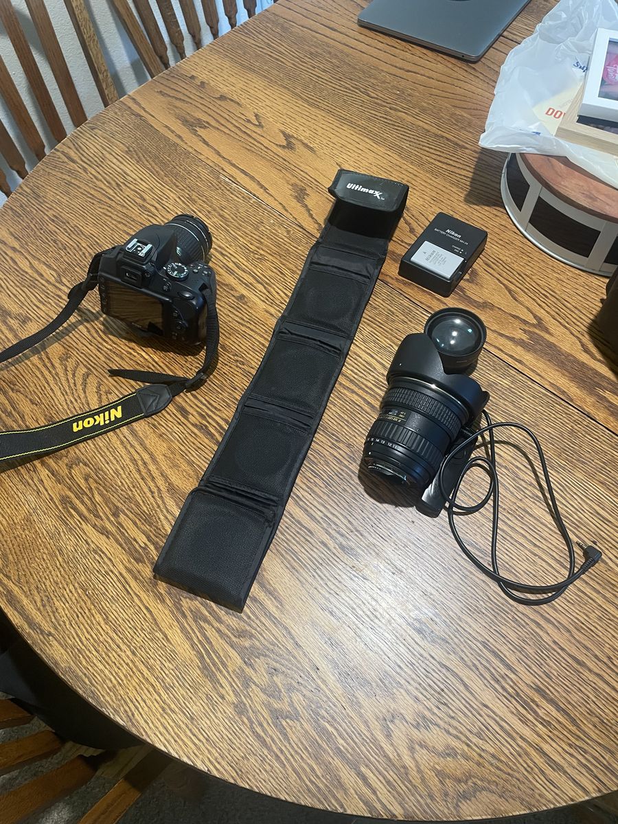 Nikon camera with all lenses and a wide angle lens