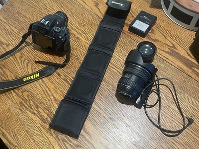 Nikon camera with all lenses and a wide angle lens