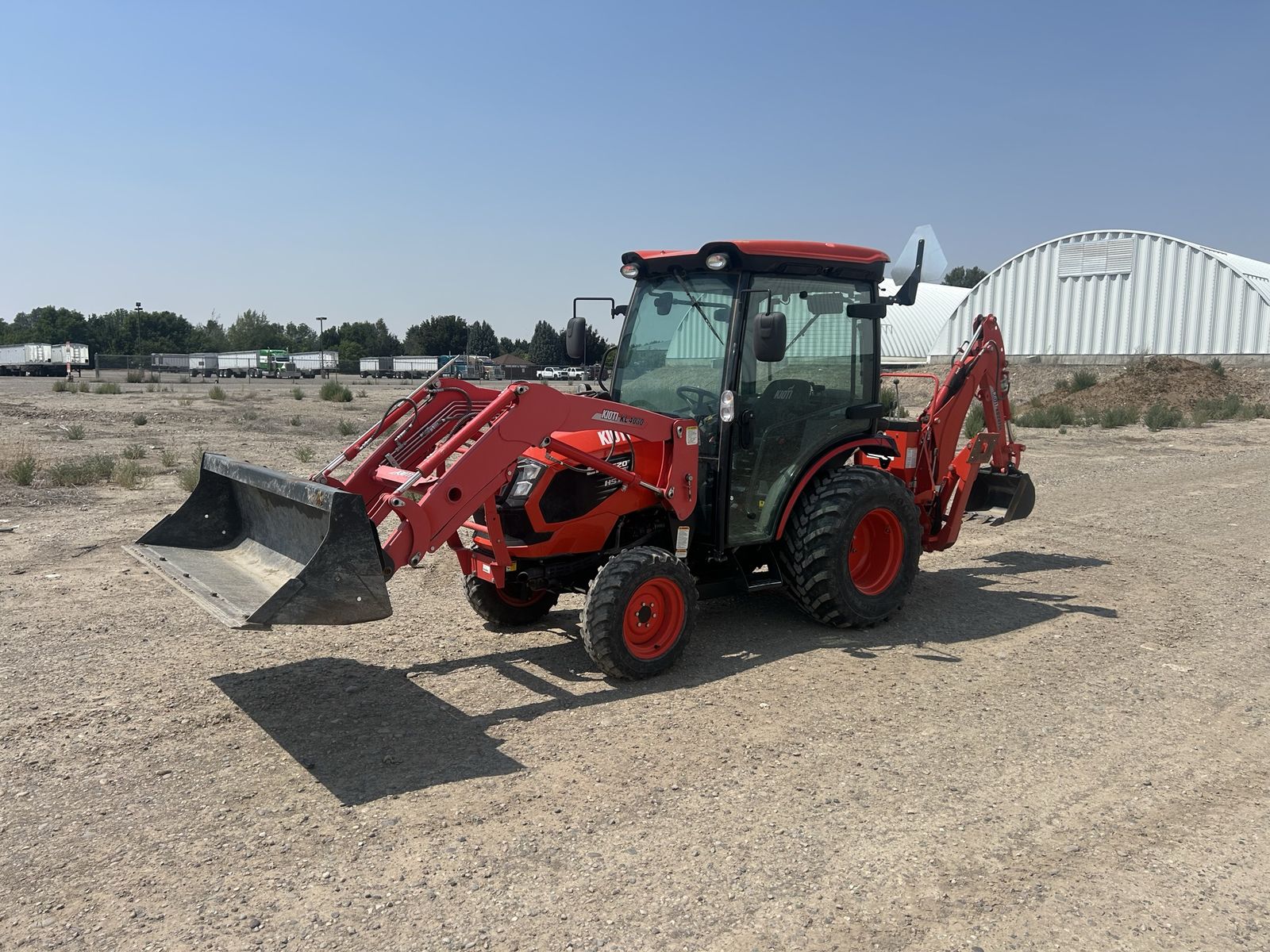 Kioti CX2510 HST Compact Tractor with Enclosed Cab, Front Loader & Backhoe