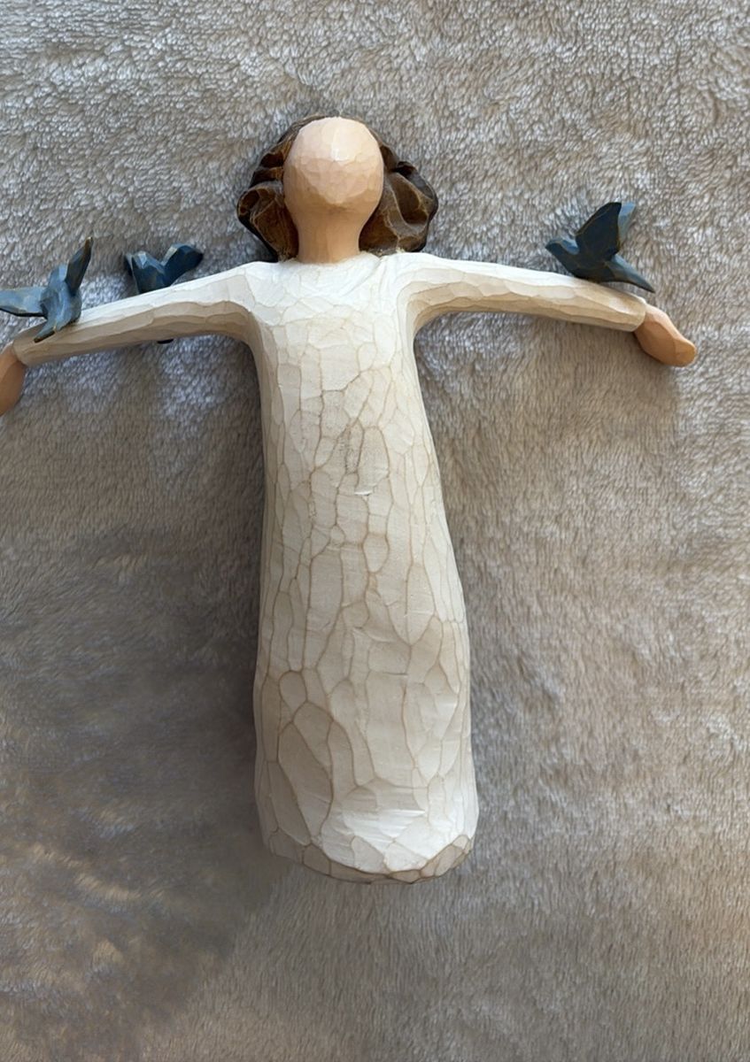 "Happiness" figure from the Willow Tree collection