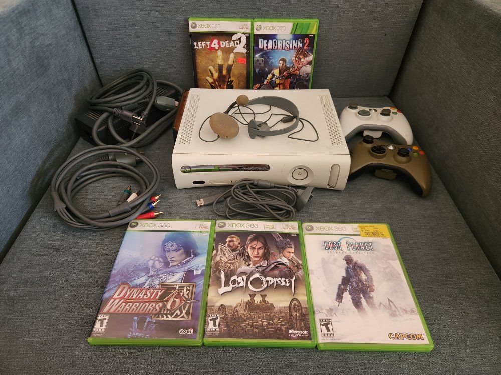 xbox 360 W/ cords, 2 controllers*, controller charging cable & headset, 5 games.
