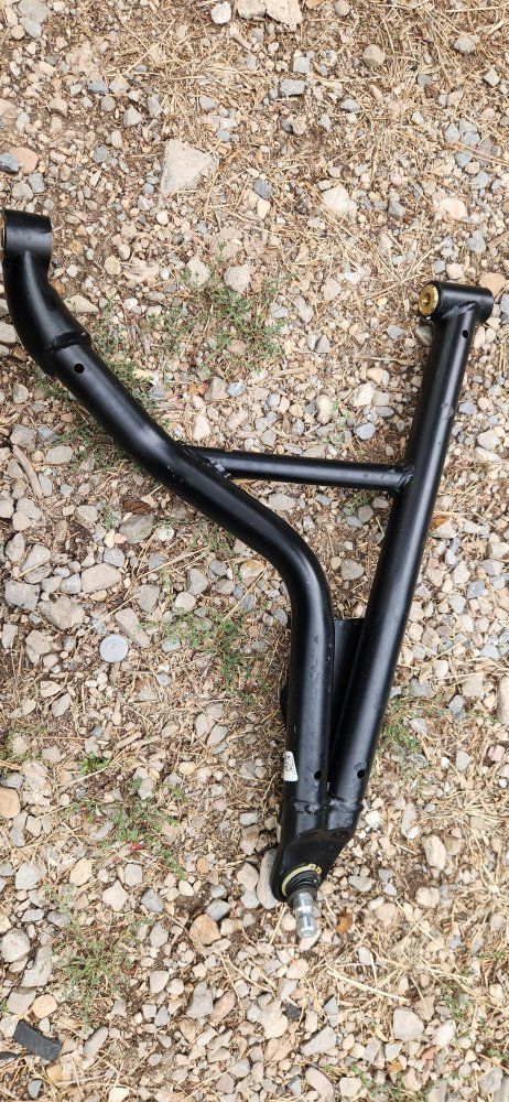 LOWER A-ARM DRIVER SIDE FRONT
