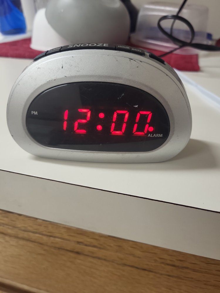 Generic Silver Digital Alarm Clock with Red LED Display & Snooze Function