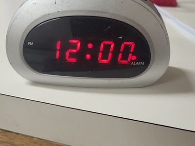 Generic Silver Digital Alarm Clock with Red LED Display & Snooze Function