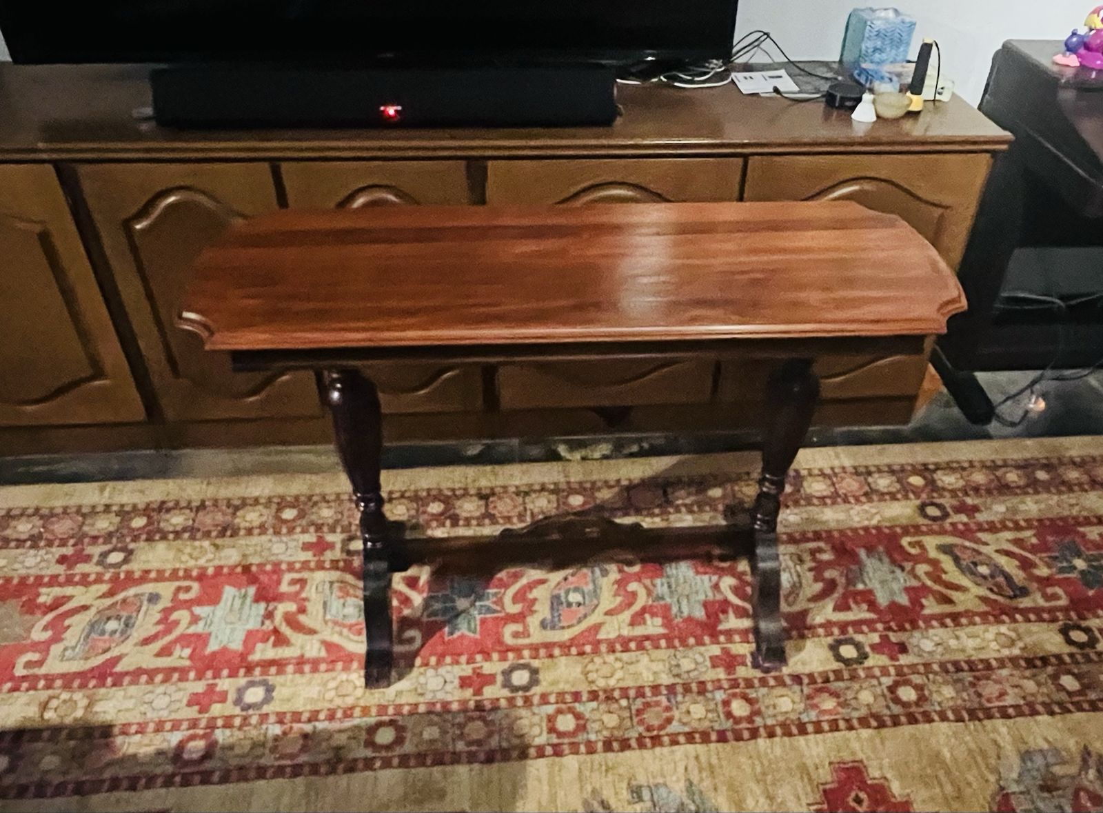 Vintage Dark Wood Console Table - Carved Legs, Scalloped Top. $100
