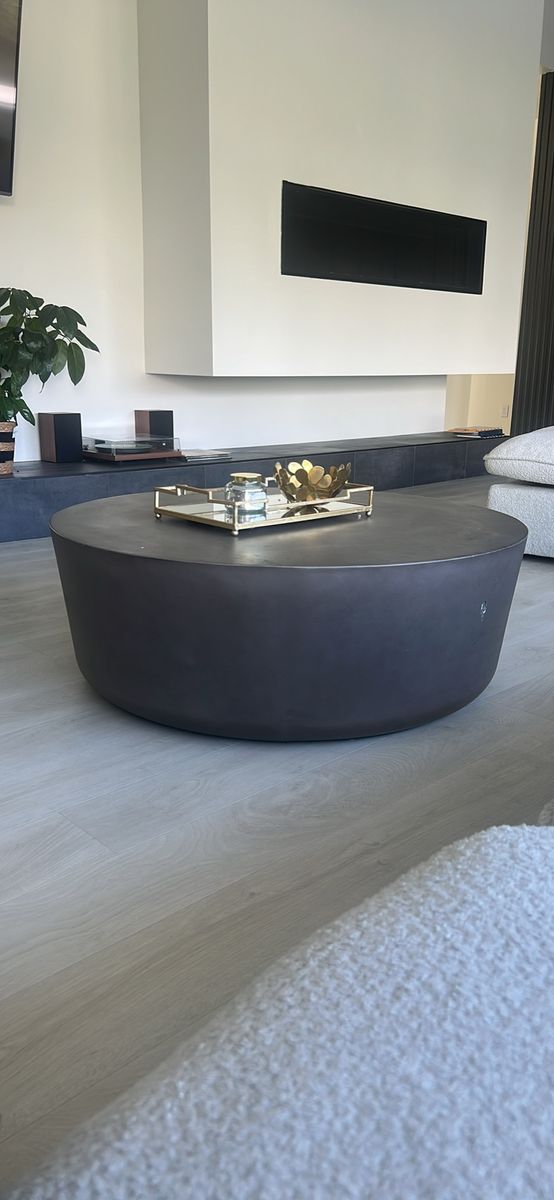 Cb2 cap grey cement table -Modern Round Coffee Table, Gray Concrete Style, Low Profile Design