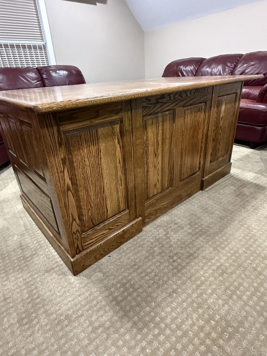 Solid oak executive desk with swivel wooden chair