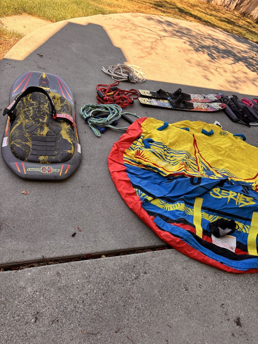 Boating items, life jackets, tube, one boat, skis, ropes, tubing helmets