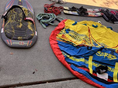 Boating items, life jackets, tube, one boat, skis, ropes, tubing helmets